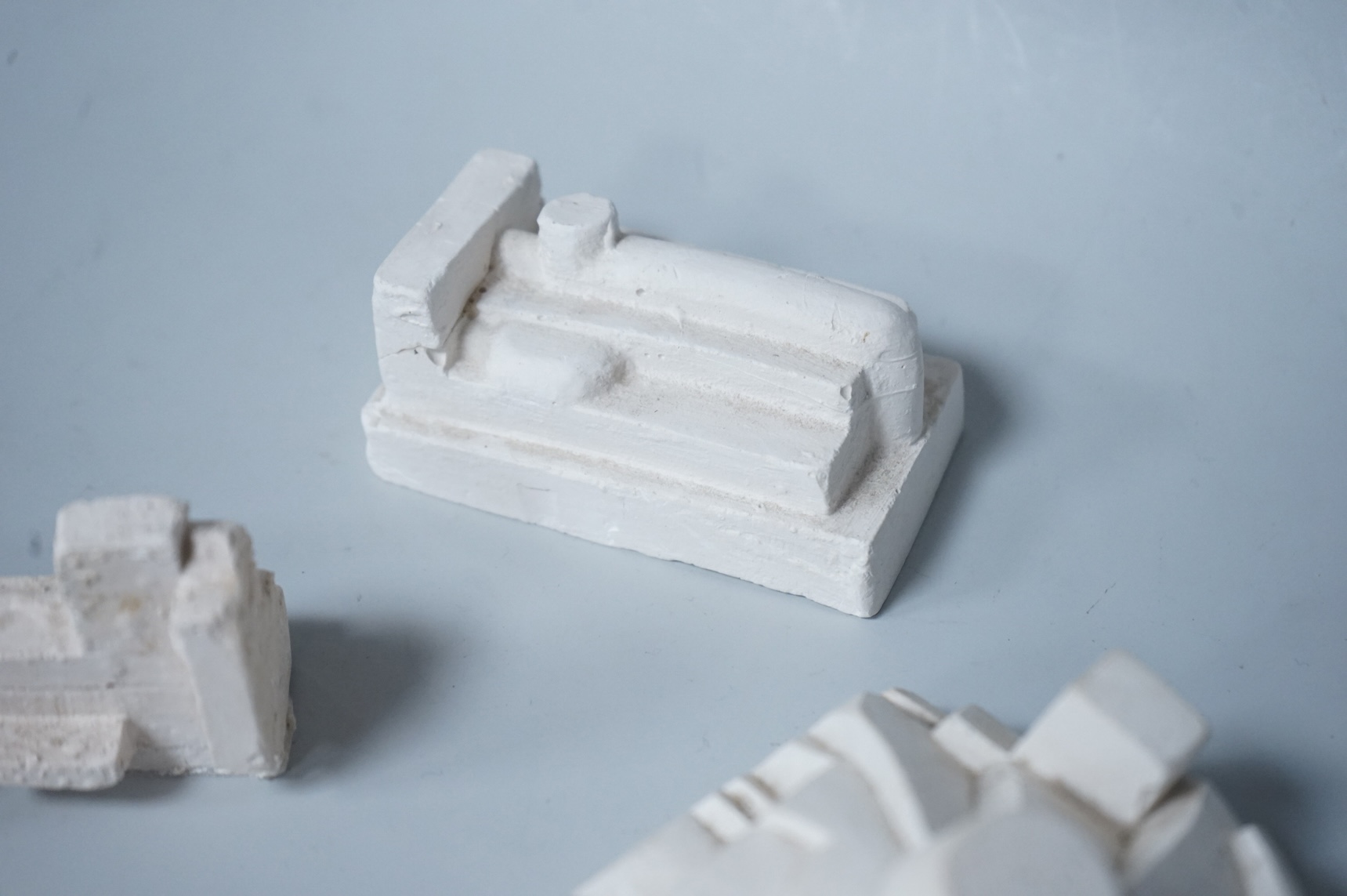 Sir Eduardo Paolozzi RA (1924-2005), three abstract plaster maquettes, signed, largest 12cm wide